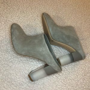 Gray heels with clear heel.